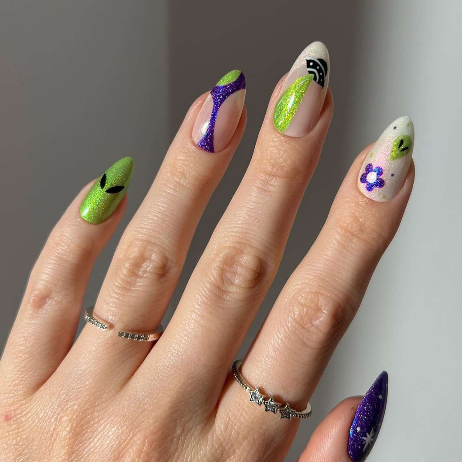 Stunning Purple and Green Halloween Nails for a Spooky Look