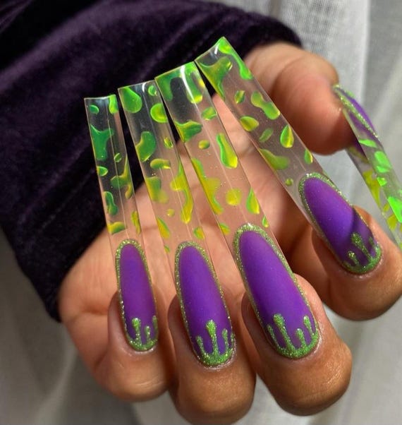 Stunning Purple and Green Halloween Nails for a Spooky Look